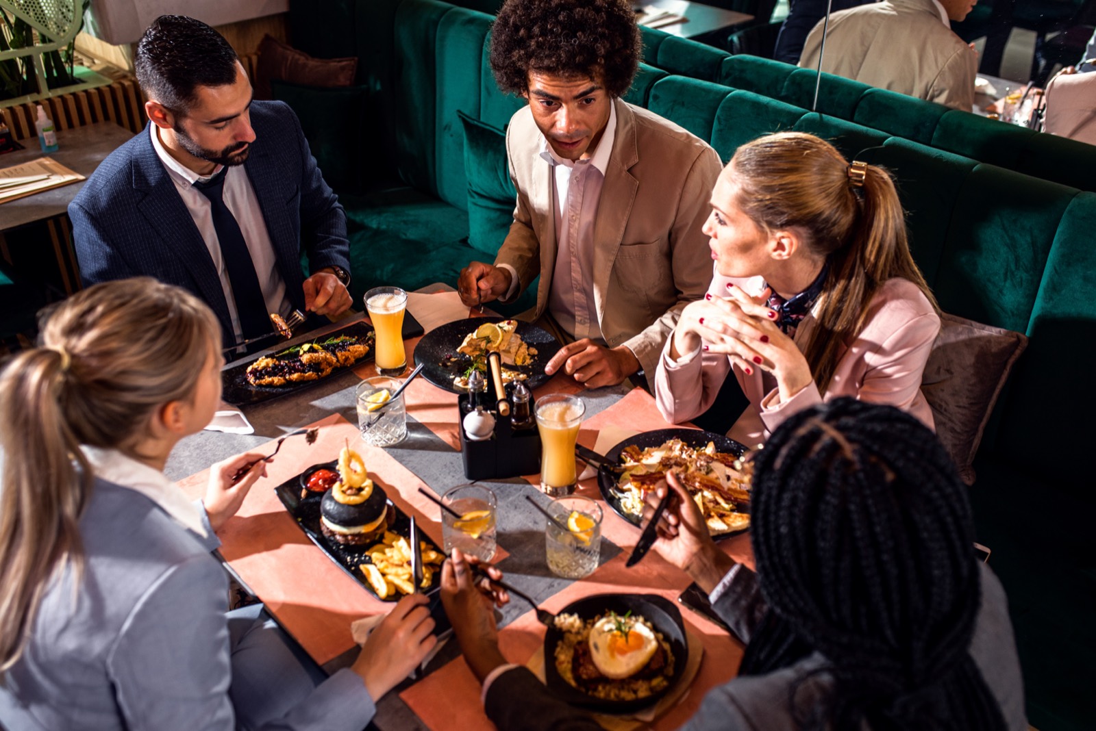 Business colleagues sharing lunch at a West Palm Beach restaurant