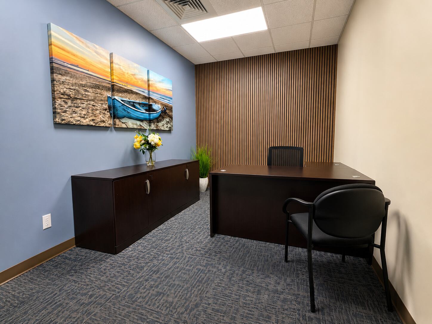 Furnished one-desk interior office with a sofa at W Executive Suites St. Lucie West