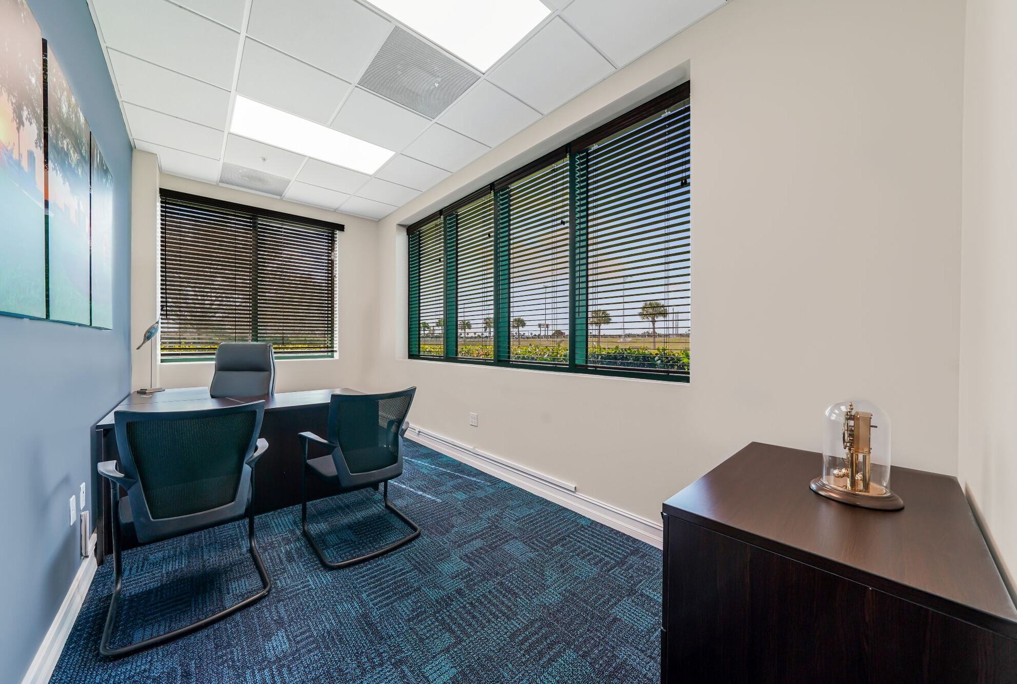 Furnished one-desk private office with windows at W Executive Suites St. Lucie West